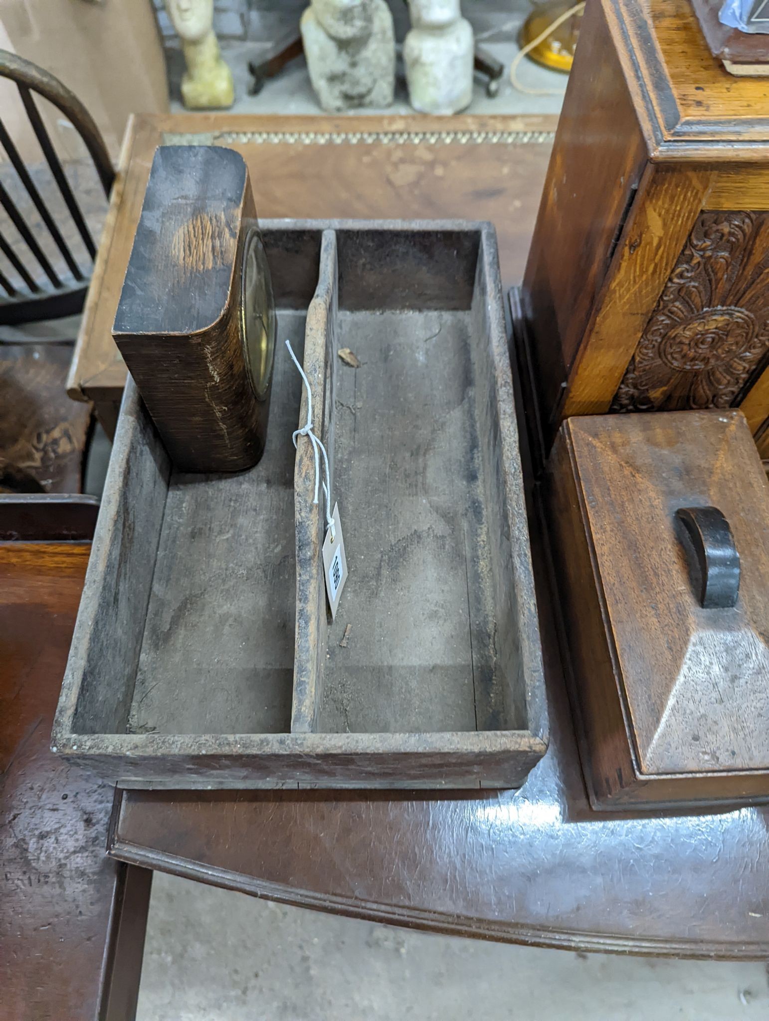 A Victorian oak smoker's box, two olive wood book rests, money box, tray, clock and a cutlery box and another